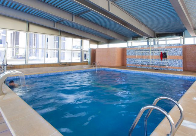 Apartment in Playa de Gandía - Amazing modern style condo, wifi free, interantional channels, heating swimming pool, children's area, BBQ Apartment in Playa de Gandía - Amazing modern style condo, wifi free, interantional channels, heating swimming pool, children's area, BBQ