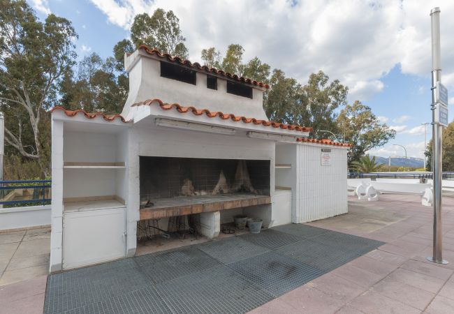 Apartment in Playa de Gandía - Amazing modern style condo, wifi free, interantional channels, heating swimming pool, children's area, BBQ Apartment in Playa de Gandía - Amazing modern style condo, wifi free, interantional channels, heating swimming pool, children's area, BBQ