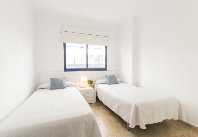 Apartment in Playa de Gandía - Amazing modern style condo, wifi free, interantional channels, heating swimming pool, children's area, BBQ Apartment in Playa de Gandía - Amazing modern style condo, wifi free, interantional channels, heating swimming pool, children's area, BBQ