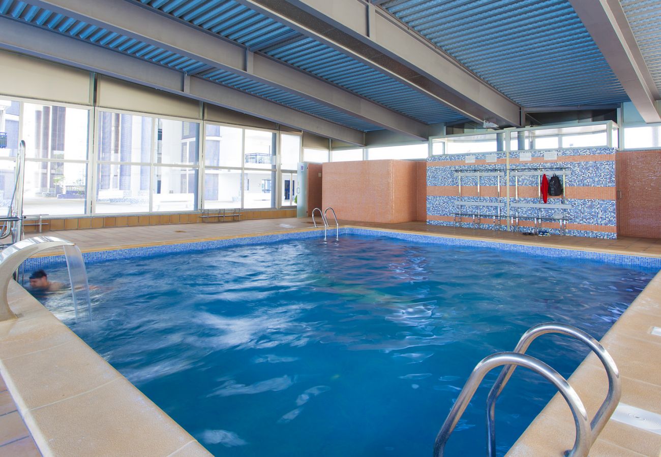Apartment in Playa de Gandía - Amazing modern style condo, wifi free, interantional channels, heating swimming pool, children's area, BBQ Apartment in Playa de Gandía - Amazing modern style condo, wifi free, interantional channels, heating swimming pool, children's area, BBQ