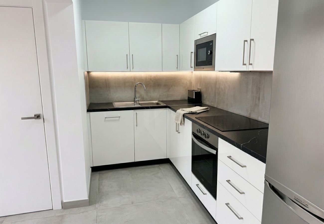 White kitchen with black countertop