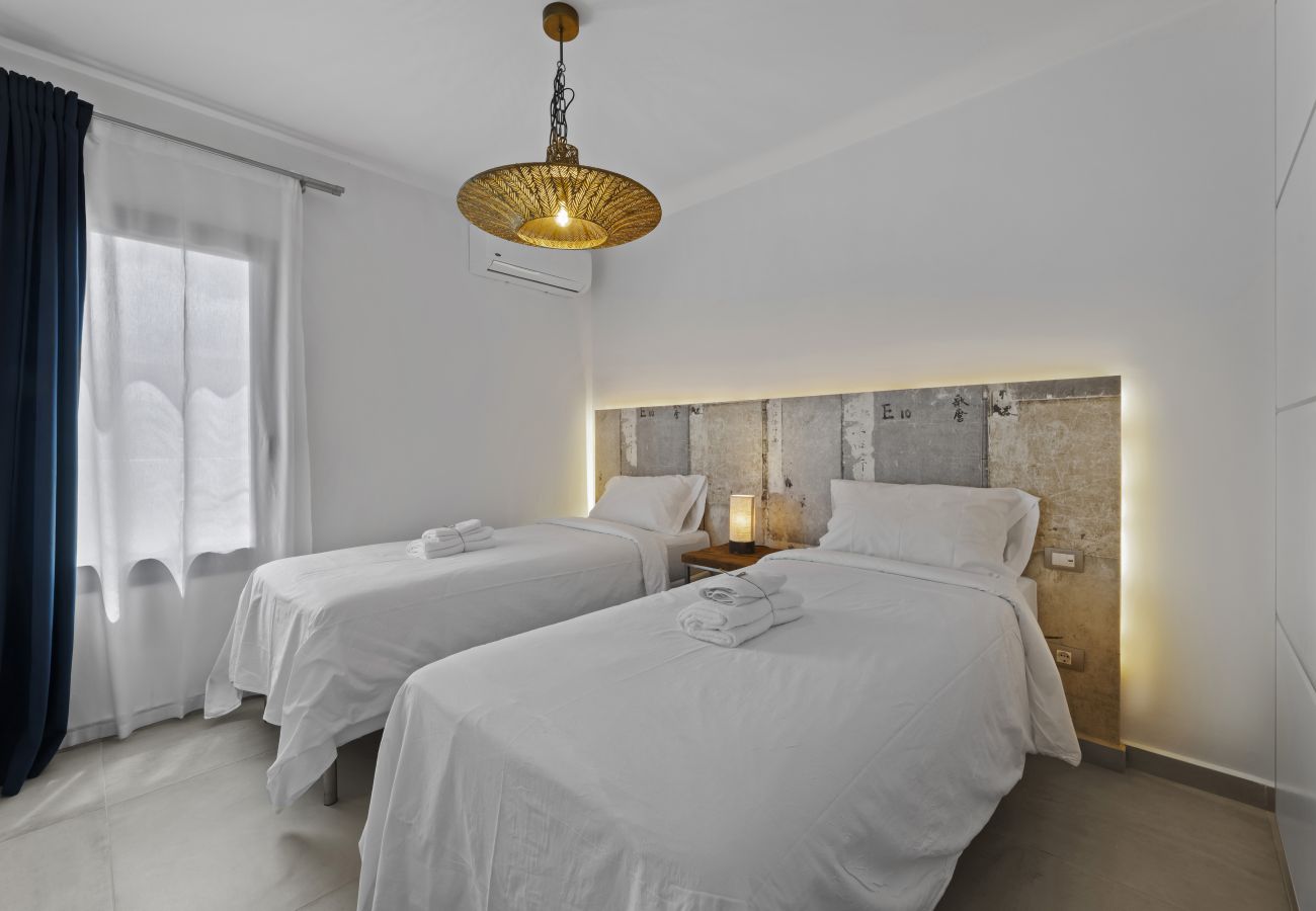 Two single beds with illuminated headboard