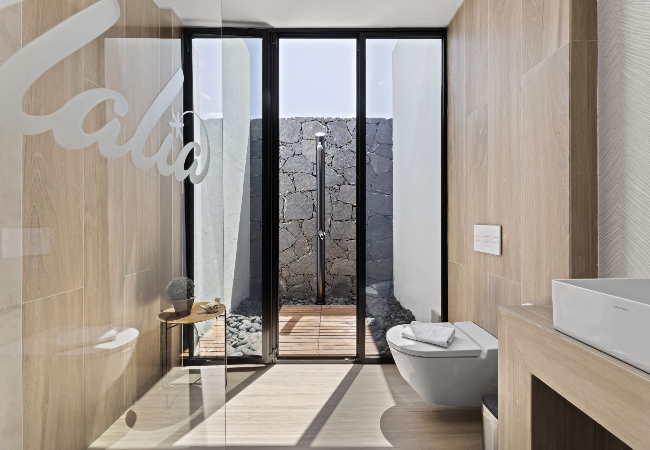 Modern bathroom with toilet and window to outside