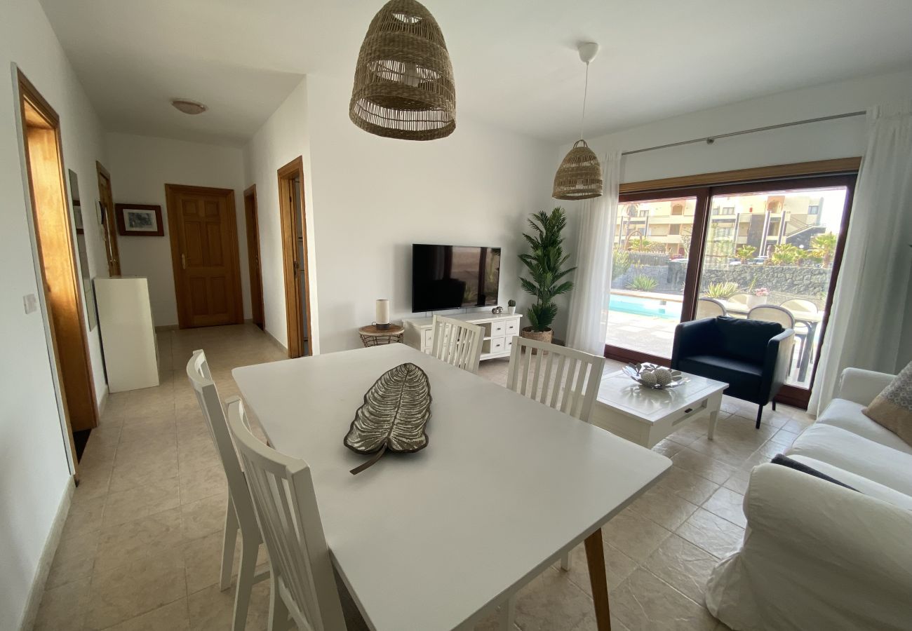 White dining table with six chairs at Villa Capri