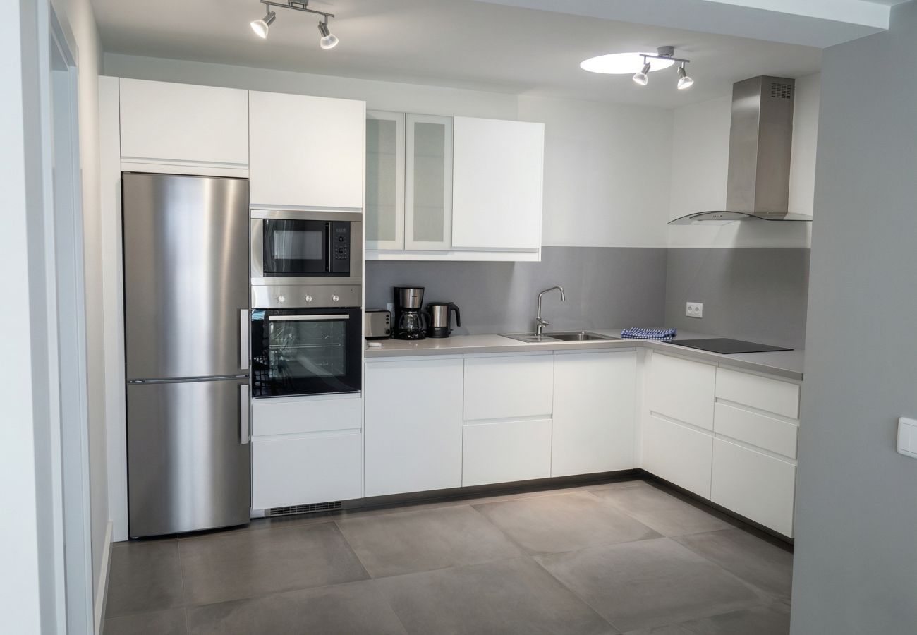 Grey and white kitchen with appliances