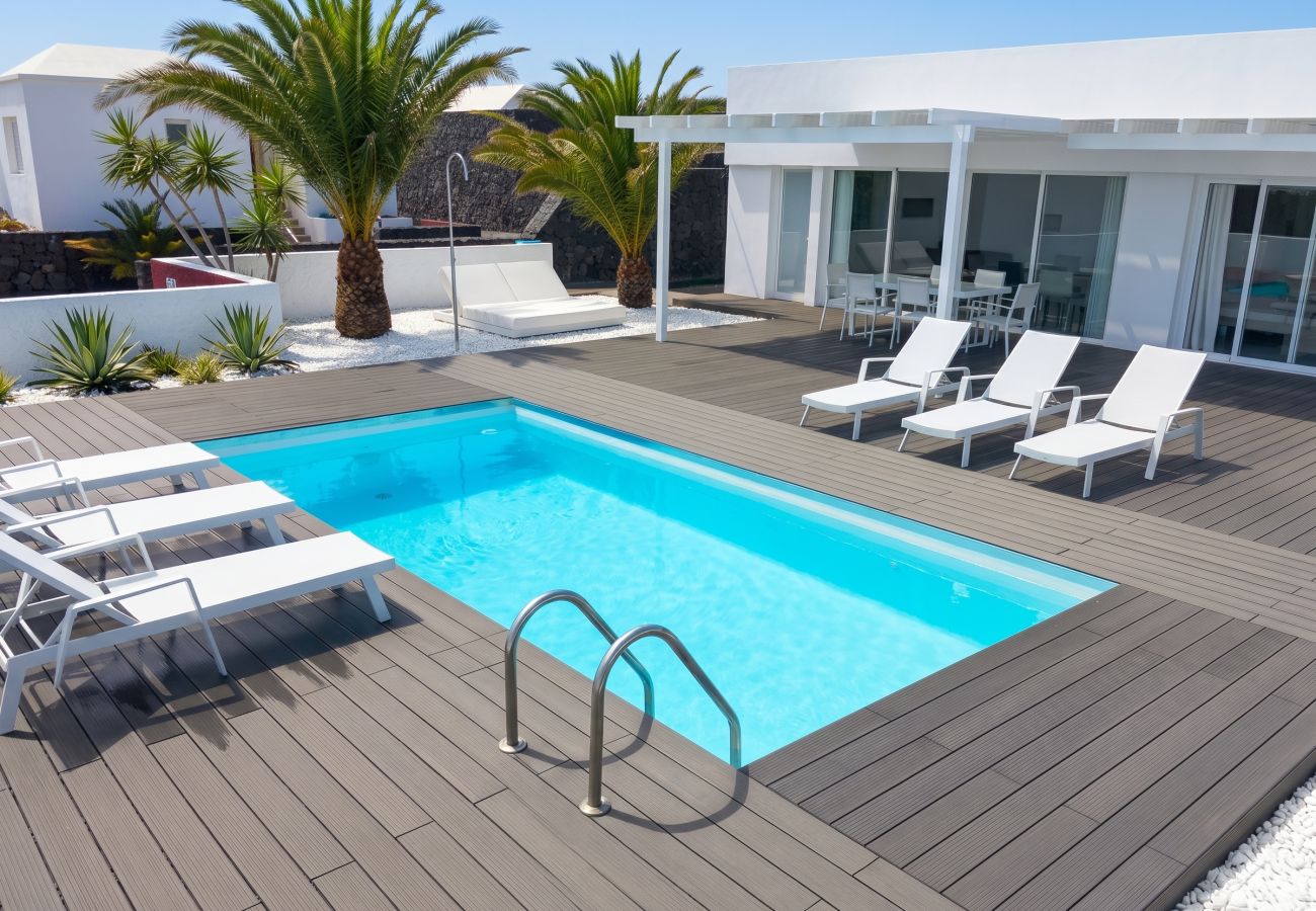 Elevated view of pool and loungers