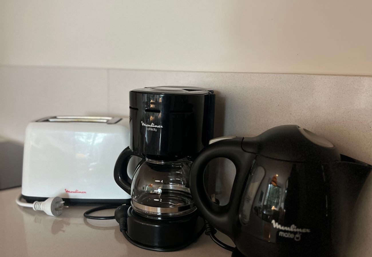 Detail of the kitchen appliances in Arrayán -1B apartment.