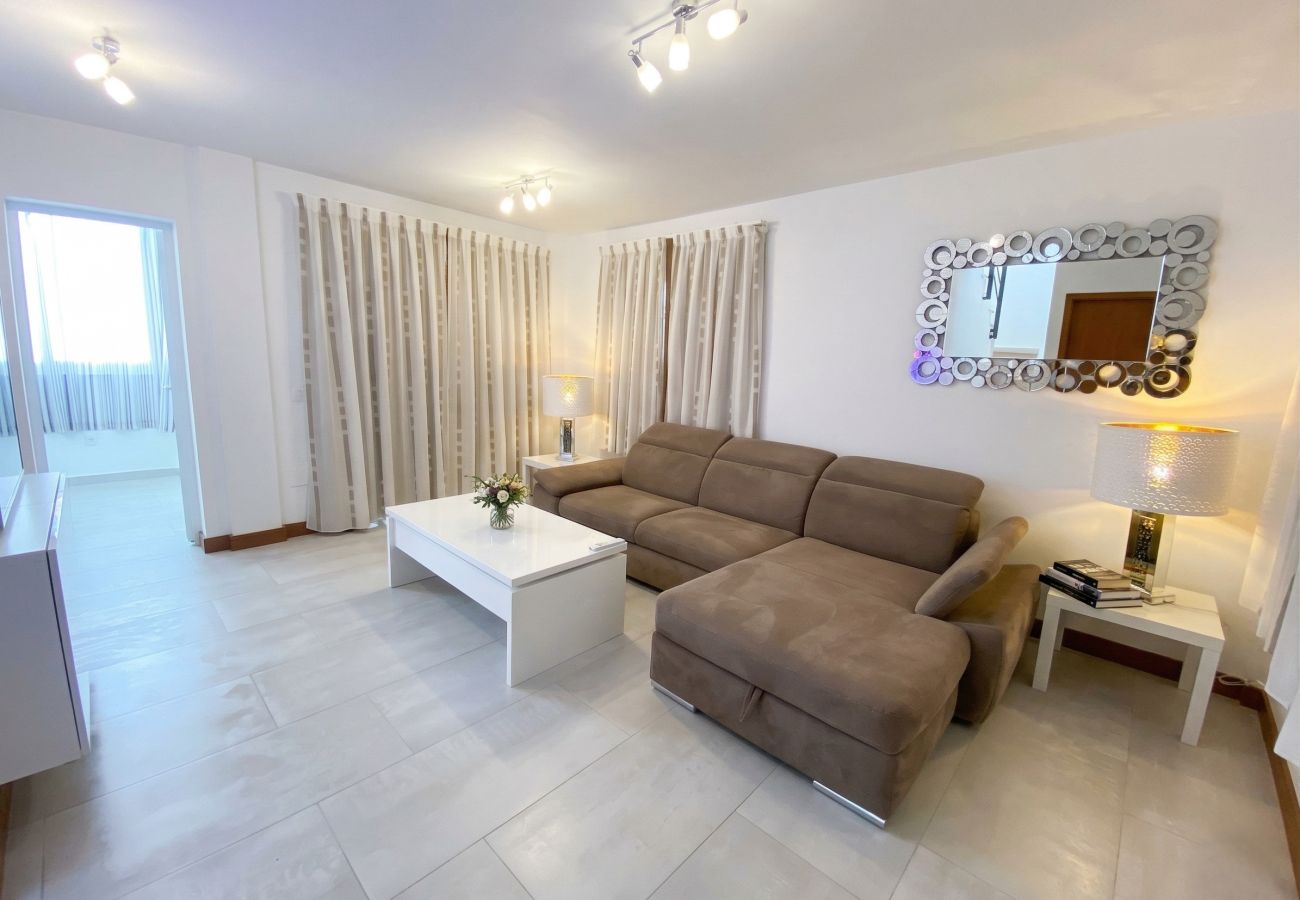 Living room with TV and outdoor access at Villa Marina Lanzarote