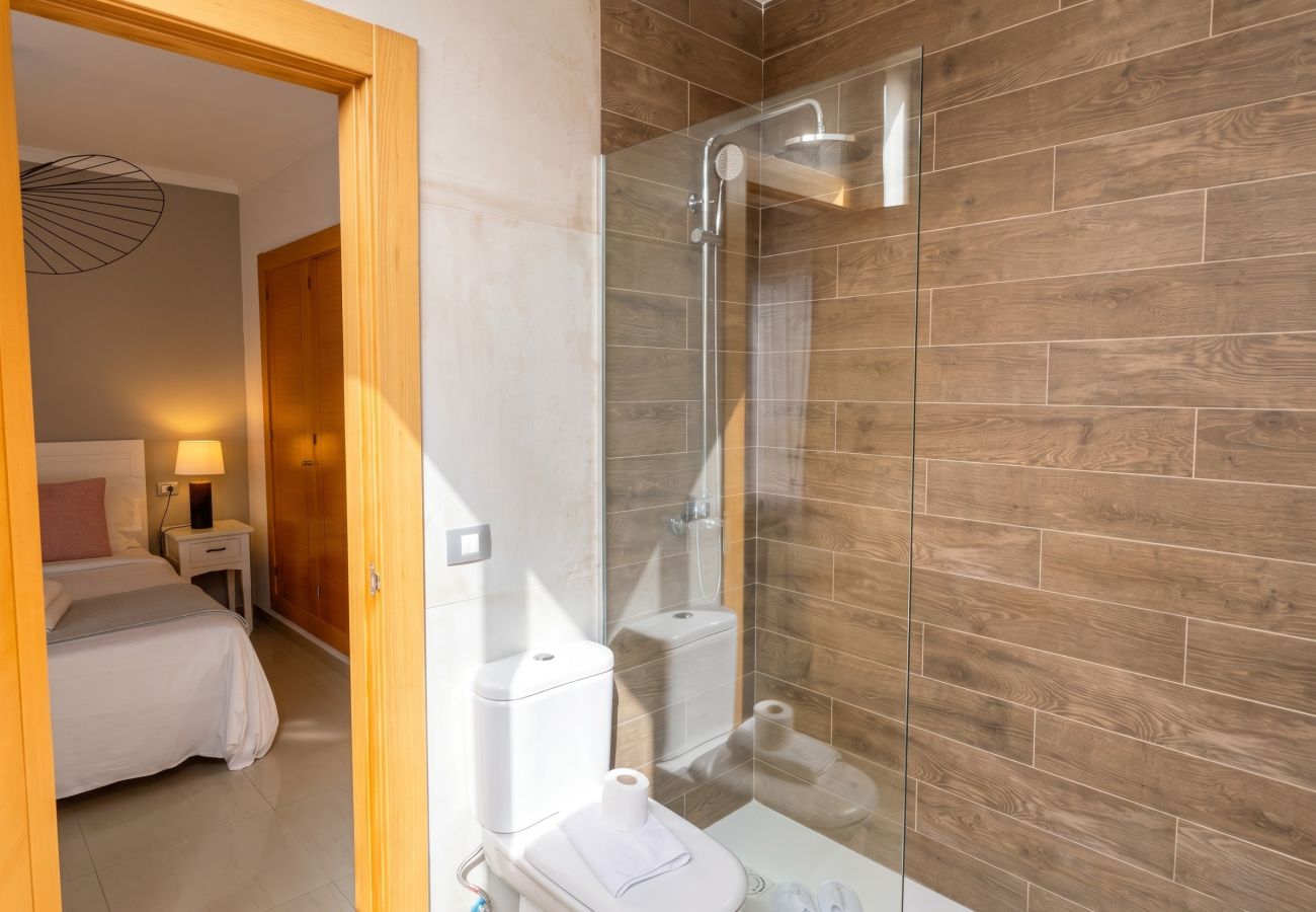 En-suite bathroom with shower and bedroom access.