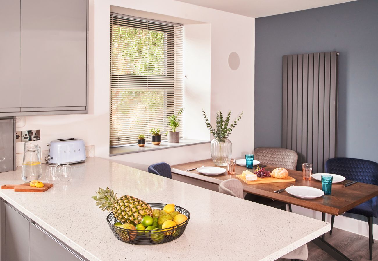 Contemporary kitchen and dining space in Torquay apartment