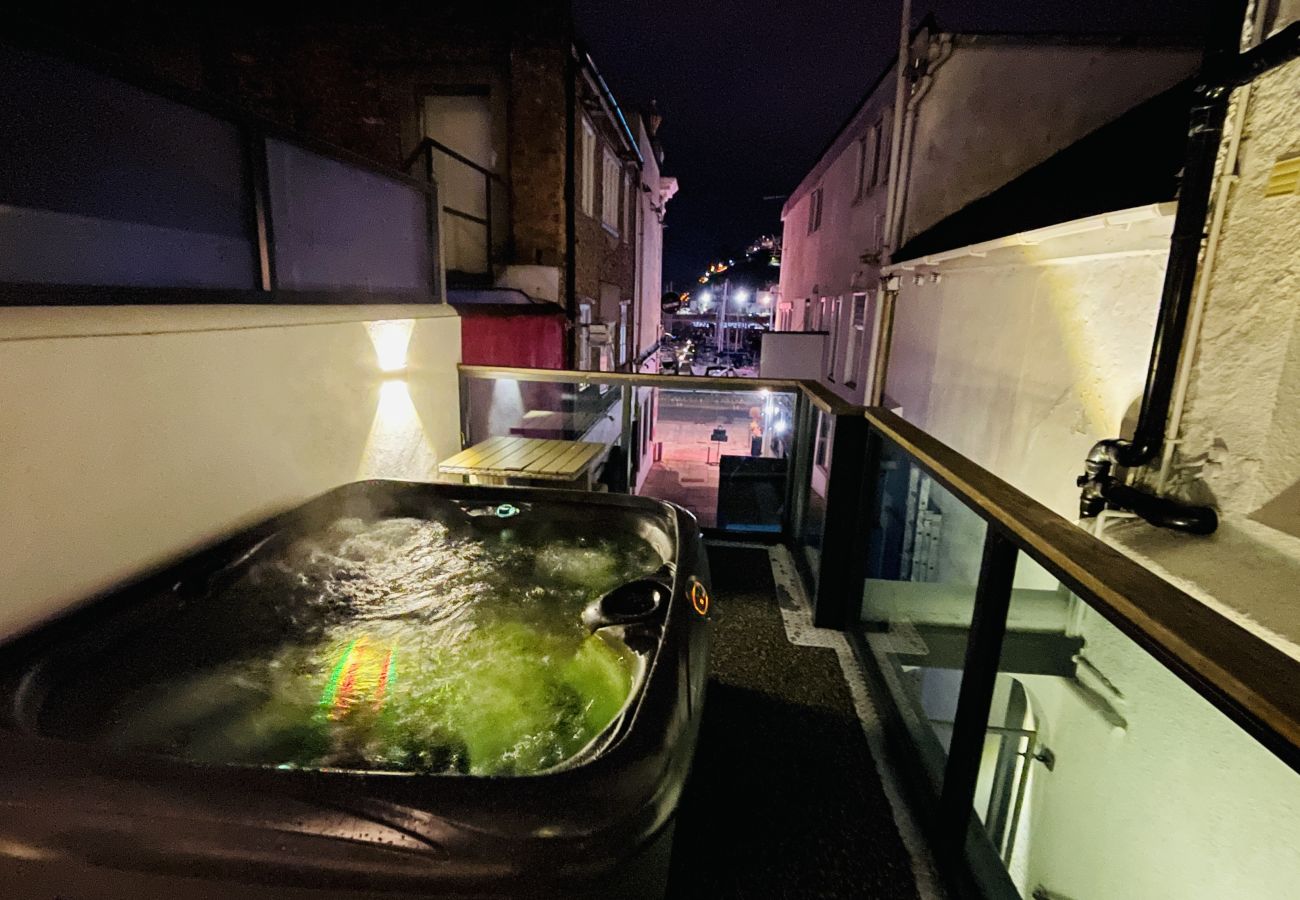 Outdoor private hot tub overlooking Torquay harbour