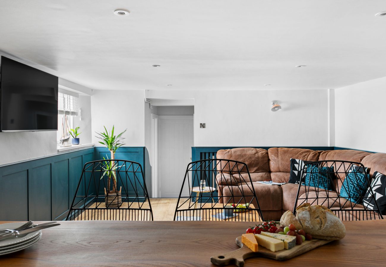 Living room in Coombe Bank apartment, Teignmouth, with dry bar and smart TV
