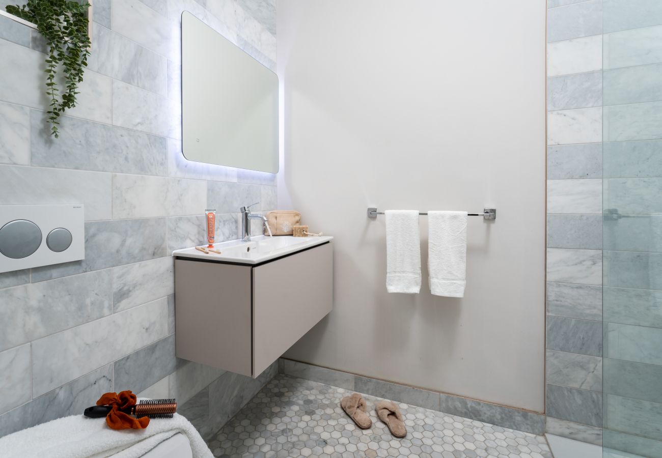 Marble shower room with premium ceramics in apartment