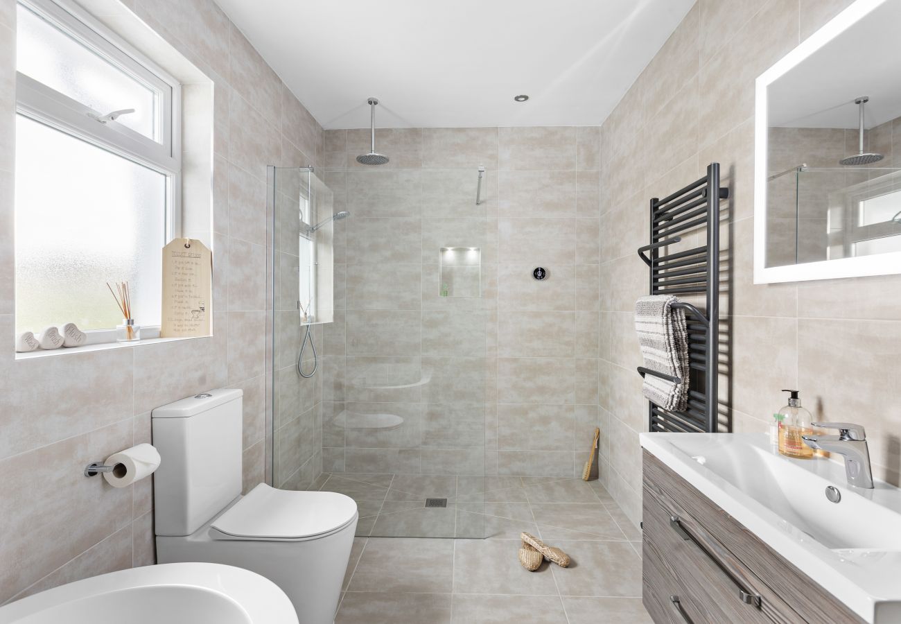 Greenacre luxury bathroom with bath