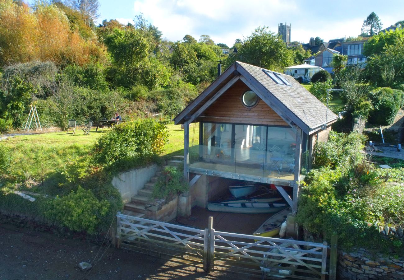 One of the most unique places to stay in Dittisham – a waterfront boathouse with stunning River Dart views.